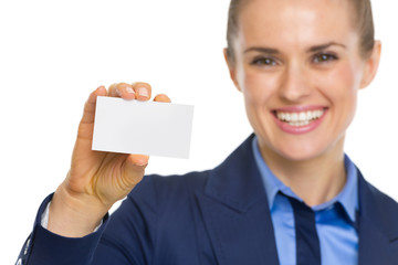 Closeup on happy business woman showing business card