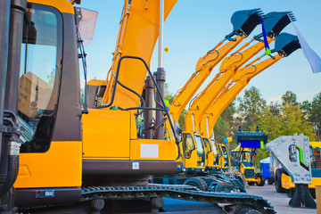 Wall Mural - Excavator new bucket against the claear sky background