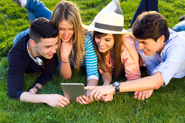 Wall Mural - Friends having fun with digital tablets