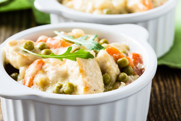 Wall Mural - Chicken stew with carrrot and green peas in a creamy sauce