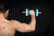 © Maria Vazquez - Muscular man with dumbbells