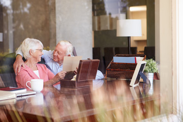 Canvas Print - Senior Couple Putting Letter Into Keepsake Box