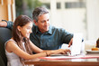 © Monkey Business - Father And Teenage Daughter Looking At Laptop Together