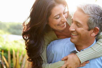 loving hispanic couple in countryside