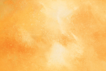 Abstract yellow/orange watercolor background.