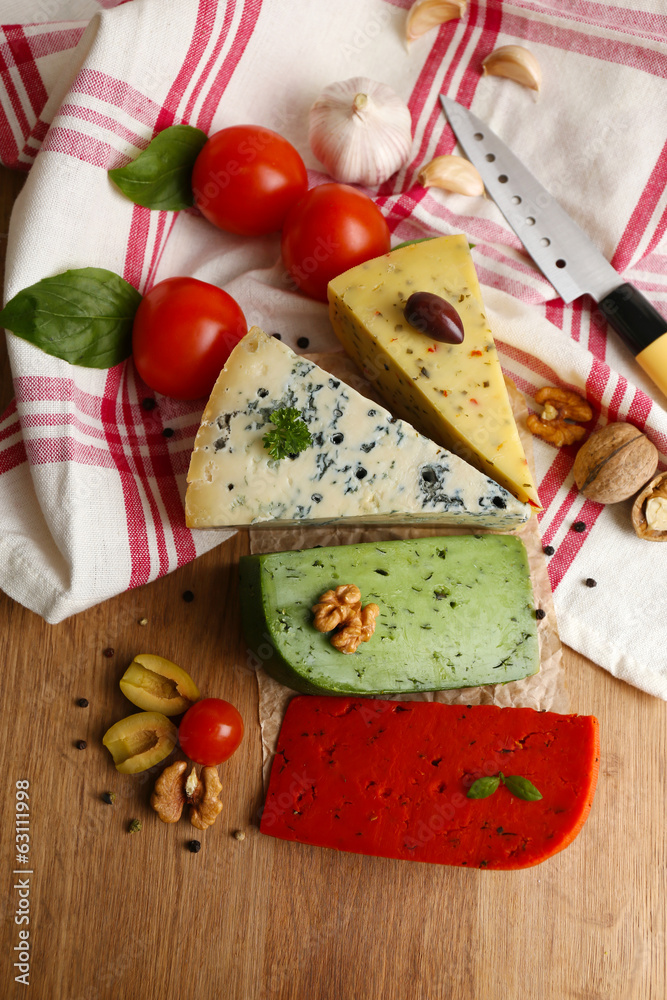 Different Italian cheese on wooden table