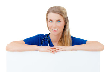 Wall Mural - Nurse / doctor showing blank board / sign.