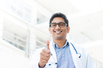 Wall Mural - Asian Indian male medical doctor thumb up