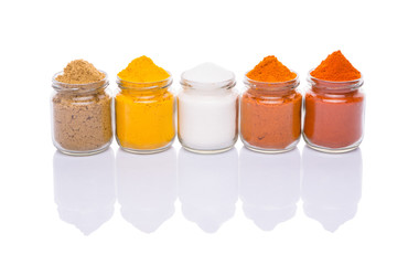 Wall Mural - Salt and various spices over white background