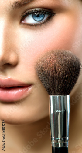 Plakat na zamówienie Makeup applying. Beautiful fashion model girl face closeup