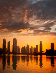 Dubai city with skyscrapers against sunset  United Arab Emirates