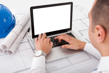 Architect Using Laptop In Office