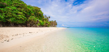 Panoramic View Of White Beach With Turquoise Water And Blue Sky