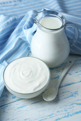 Dairy products on wooden table background