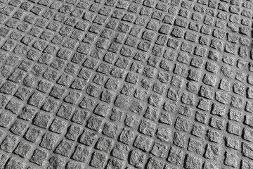 Background photo texture. Granite cobblestone road pavement patt