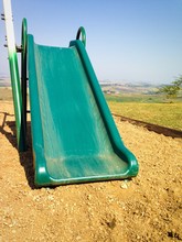 The Green Slide In The Playground