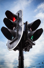 Red Stop Signal For Cars And Green Pedestrian Light On Urban Tra