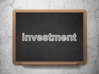 Business concept: Investment on chalkboard background