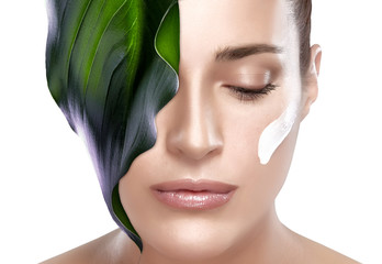 Wall Mural - beautiful spa girl with leaf on her face. skincare concept