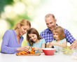 © Syda Productions - happy family with two kids making dinner at home