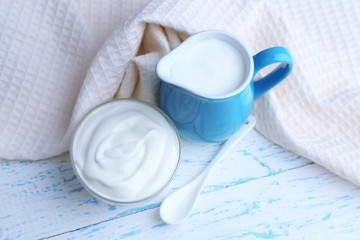 Canvas Print - Dairy products on wooden table background