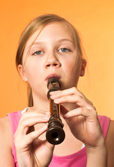 The recorder being played by a girl