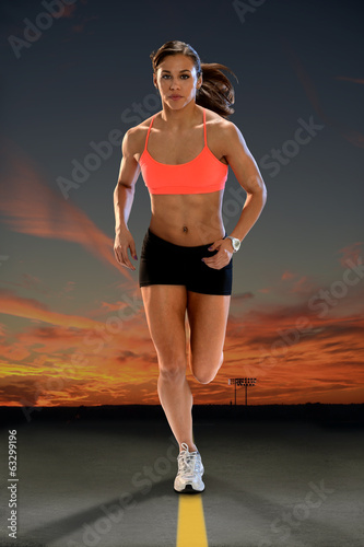 Fototapeta dla dzieci Young Woman Running at Sunset