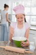 © lightwavemedia - Girl helping her mother prepare food in kitchen