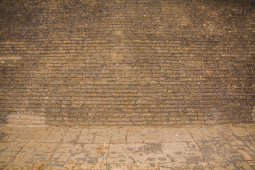  Old weathered wall of bricks and a ground