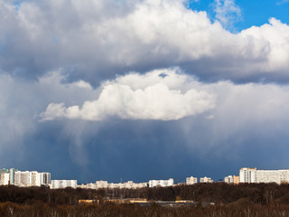 Wall Mural - snow clouds over city