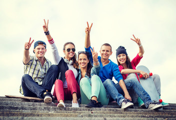 Canvas Print - group of teenagers showing finger five