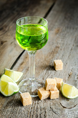 Poster - Glass of absinthe with lime and sugar cubes