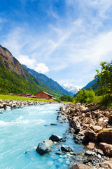 Wall Mural - Beautiful Swiss landscape with river stream