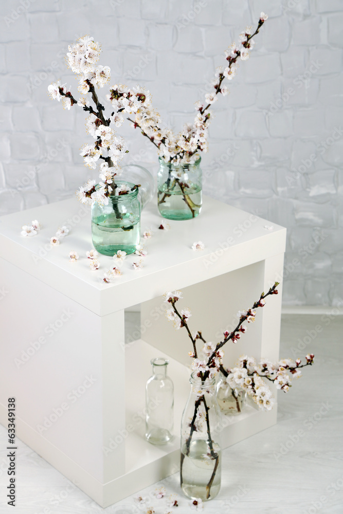 Beautiful apricot blossom in transparent jars