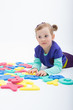© gbzero - Little girl playing with letters and numbers