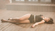Sexy woman in a dancing suit "GO-GO" lying n the floor