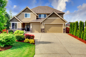 Siding house with stone trim and tile roof