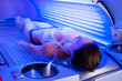 Woman on tanning bed