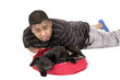 © sixdays - African American man laying by his labrador puppy