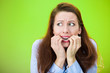 © pathdoc - Anxiety. Scared woman biting fingernails, green background