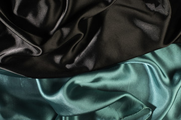 Shiny black and green satin fabric