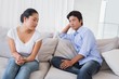 © WavebreakMediaMicro - Couple not talking after a dispute on the sofa