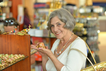 Wall Mural - Woman at souvenir store