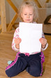 © Daddy Cool - Pretty little blond girl sitting reading a letter