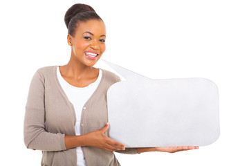 african woman holding speech bubble