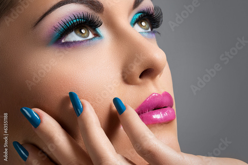 Fototapeta na wymiar Beautiful girl with colorful makeup