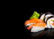 Sushi collection, isolated on black background.