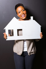 Poster - african girl holding paper house