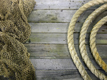 Wooden Background With Net And Rope Roll