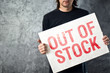 © Bits and Splits - Out of Stock sign in hands of storage employee